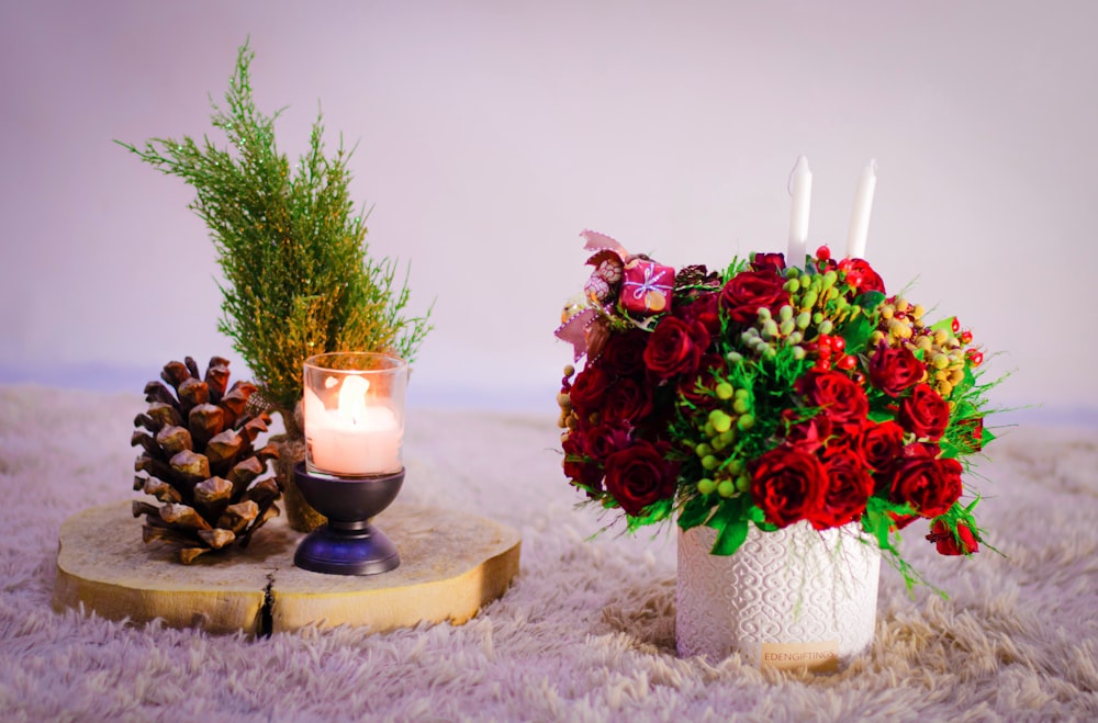 a couple of candles and flowers