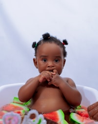 a baby with a flower crown