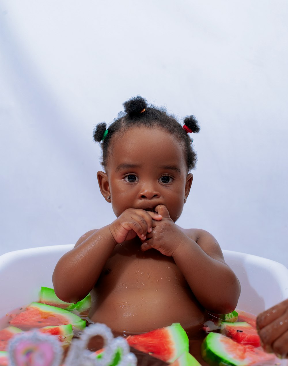 a baby with a flower crown