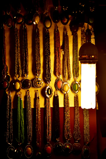 Beautiful necklaces arranged artistically on a marble surface with soft lighting