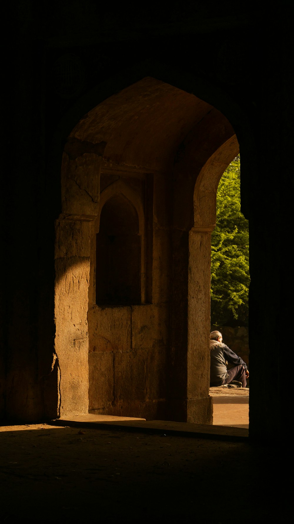 a person sitting in a doorway