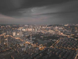 A vibrant city skyline at dusk illustrating urban expansion.