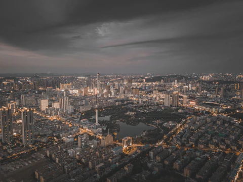 A vibrant city skyline at dusk illustrating urban expansion.