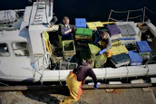 Friendly Go Star Enterprises team members coordinating cargo loading at the dock.