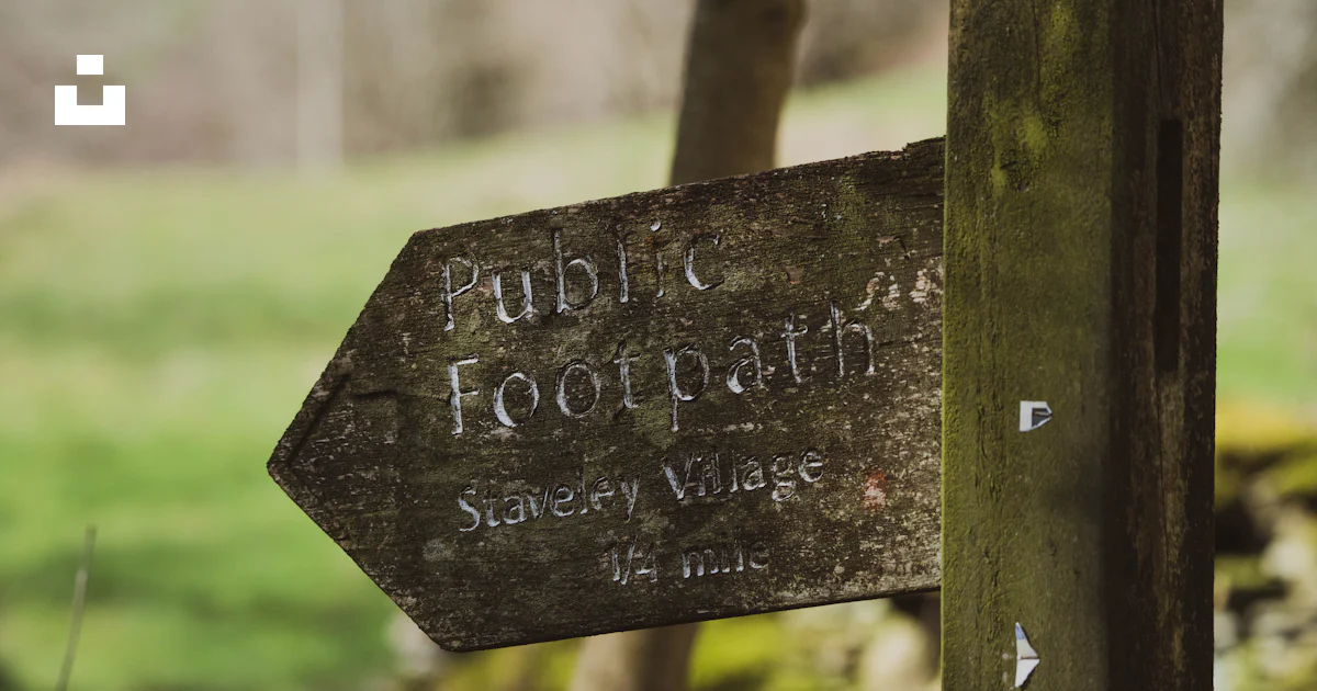 A wooden sign with writing on it photo – Free Staveley Image on Unsplash