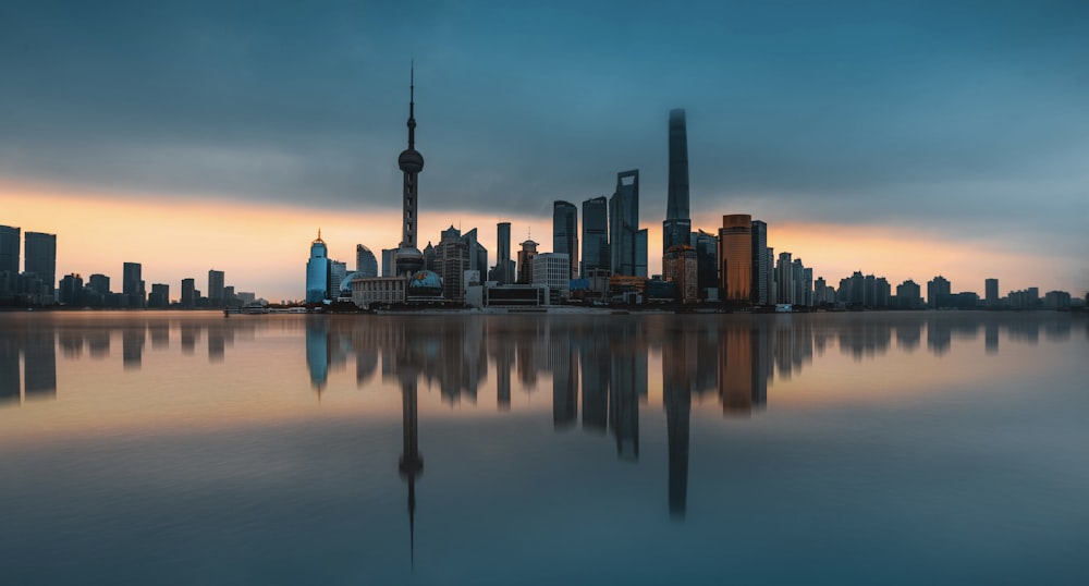 a large body of water with a city in the background