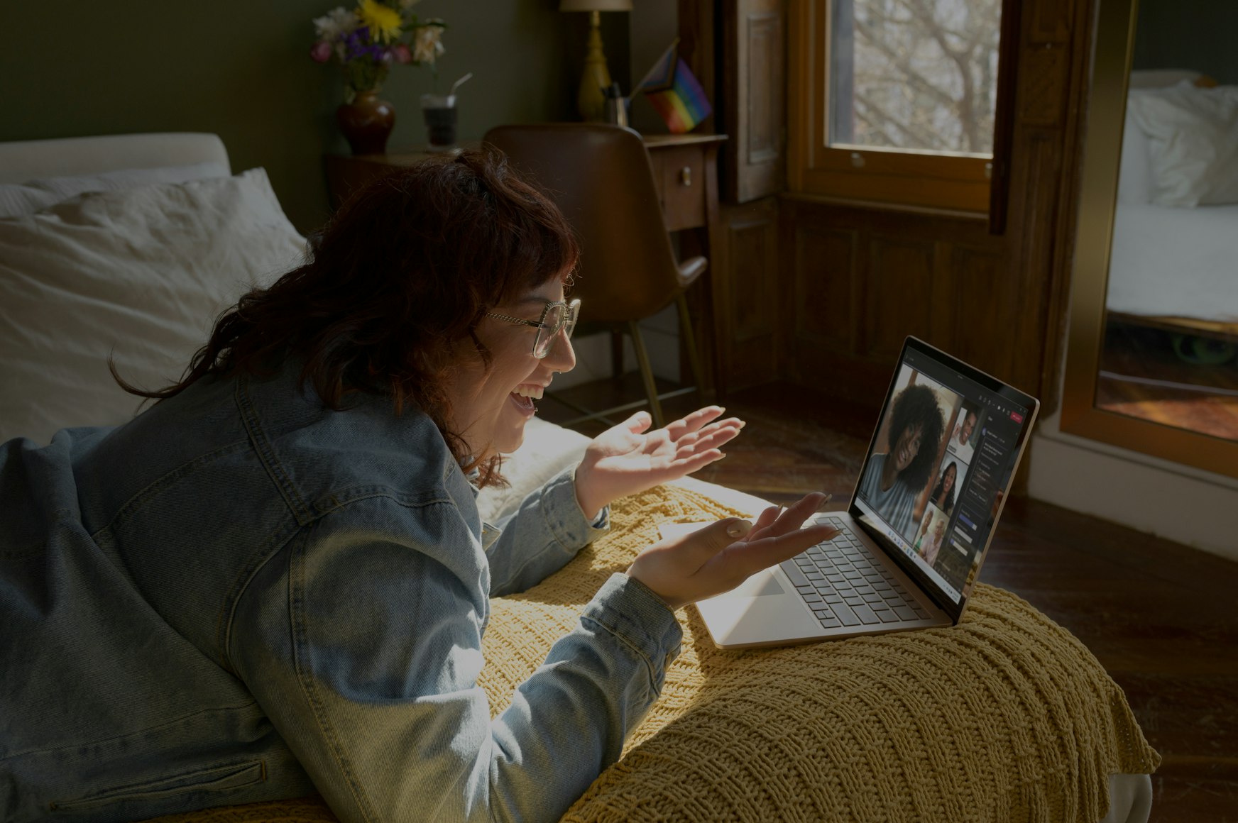 Buy Redox Cell Signaling Supplement - Healing Tao Australia. Smiling old woman laying on a bed having a video conference on skype