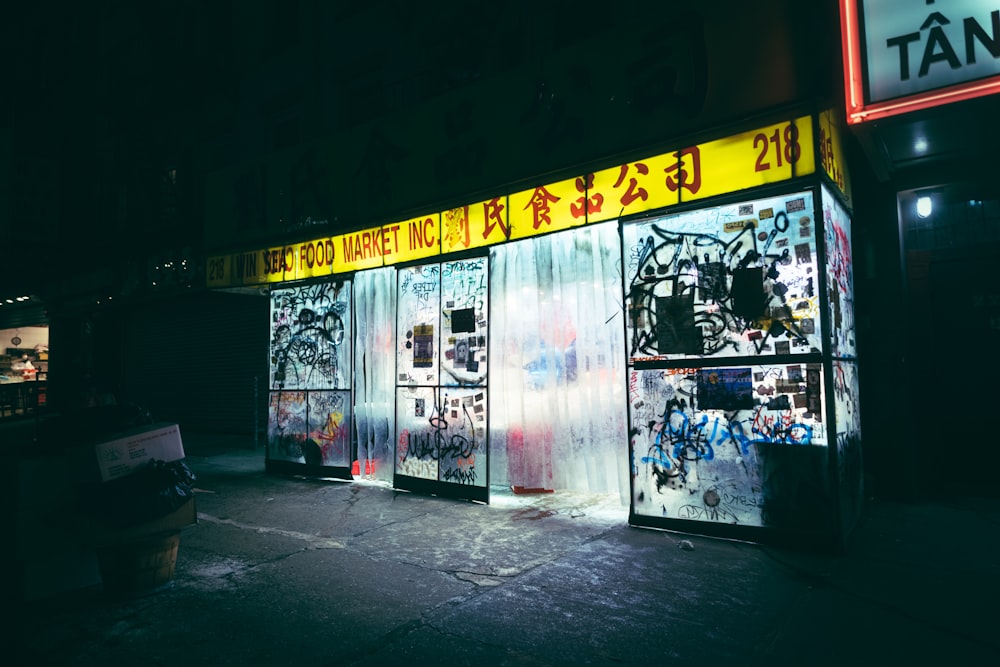 a store front with a lot of graffiti on it