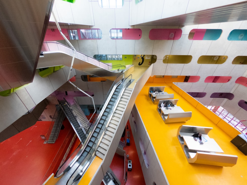 a train track going through a colorful building