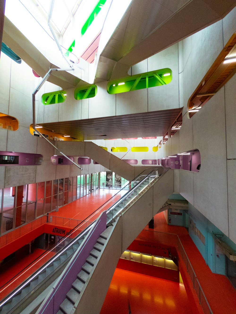 a building with a red floor and green and yellow lights