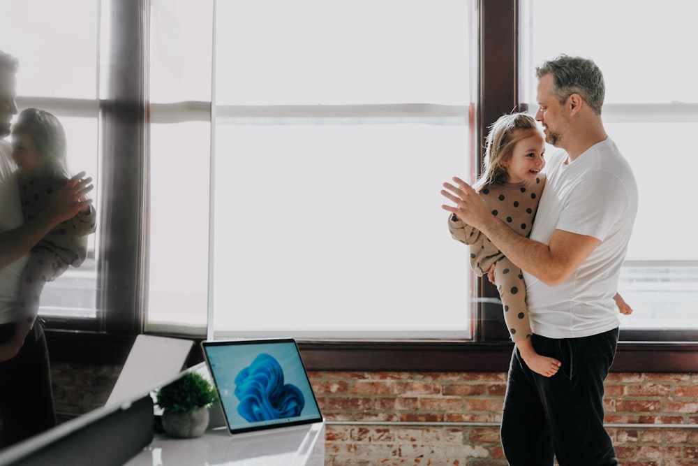 a man and a woman hug in an office