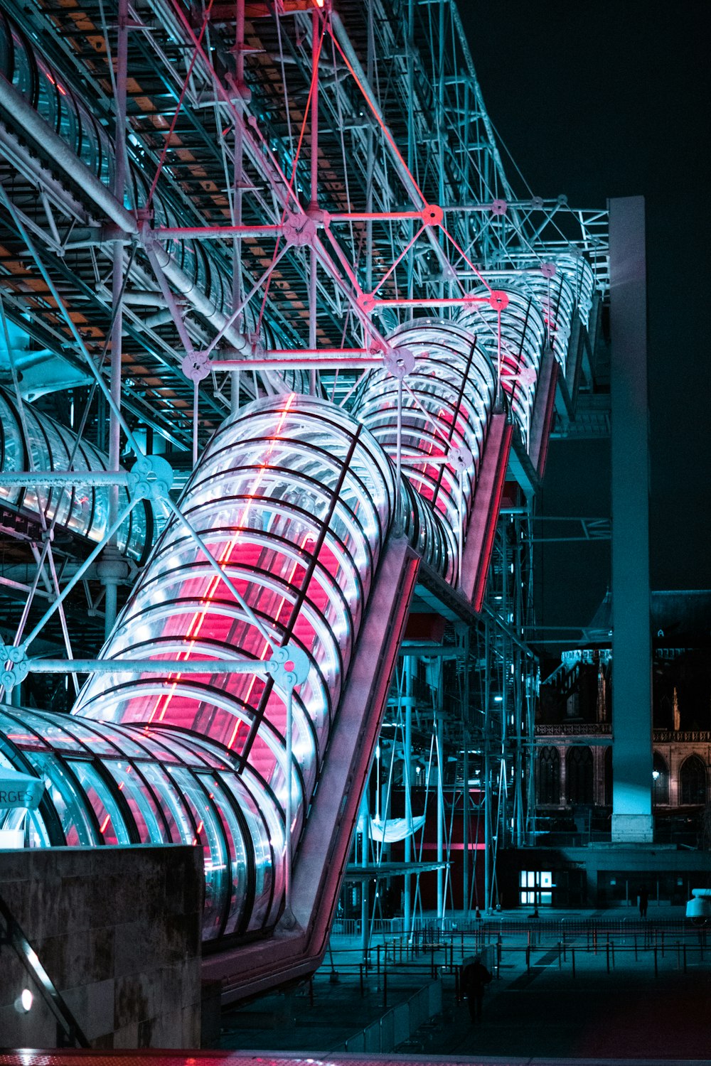 a large metal structure with red lights on it