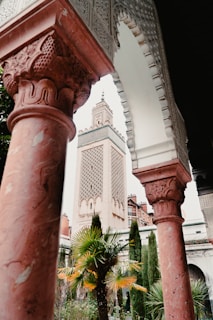 a tall building with a clock tower in the background