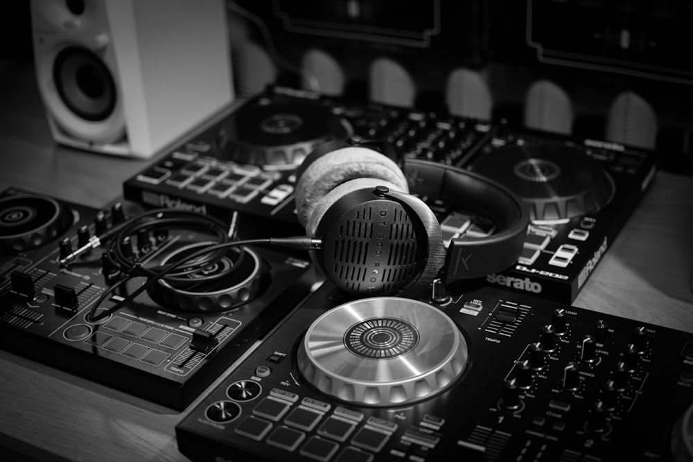 a pair of headphones sitting on top of a dj's decks