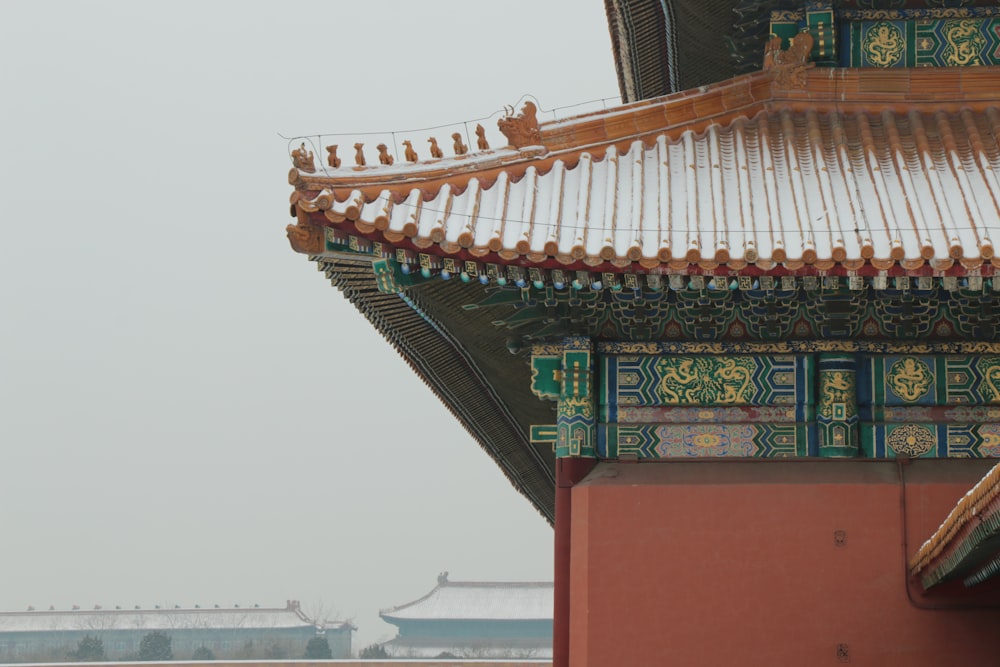 the roof of a building with a bird perched on top of it