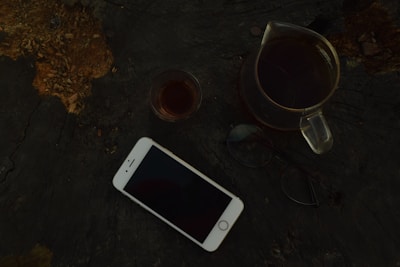 TerraPulse device resting beside a notebook and a cup of tea, suggesting daily routine integration.