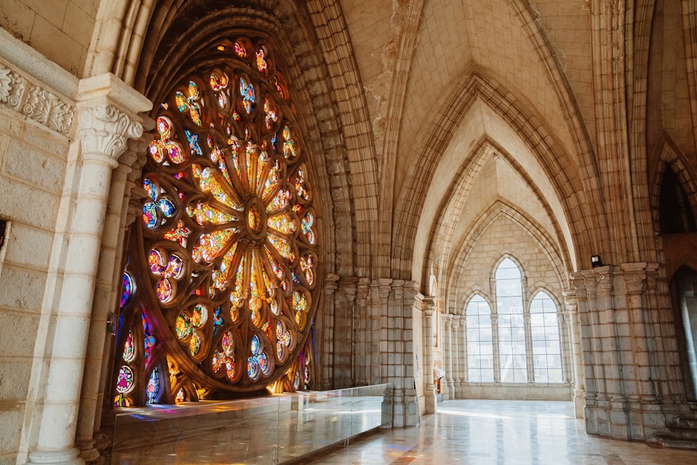 a large stained glass window inside of a building