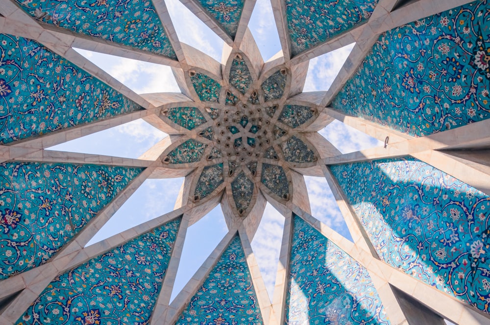 a close up of a blue and white umbrella