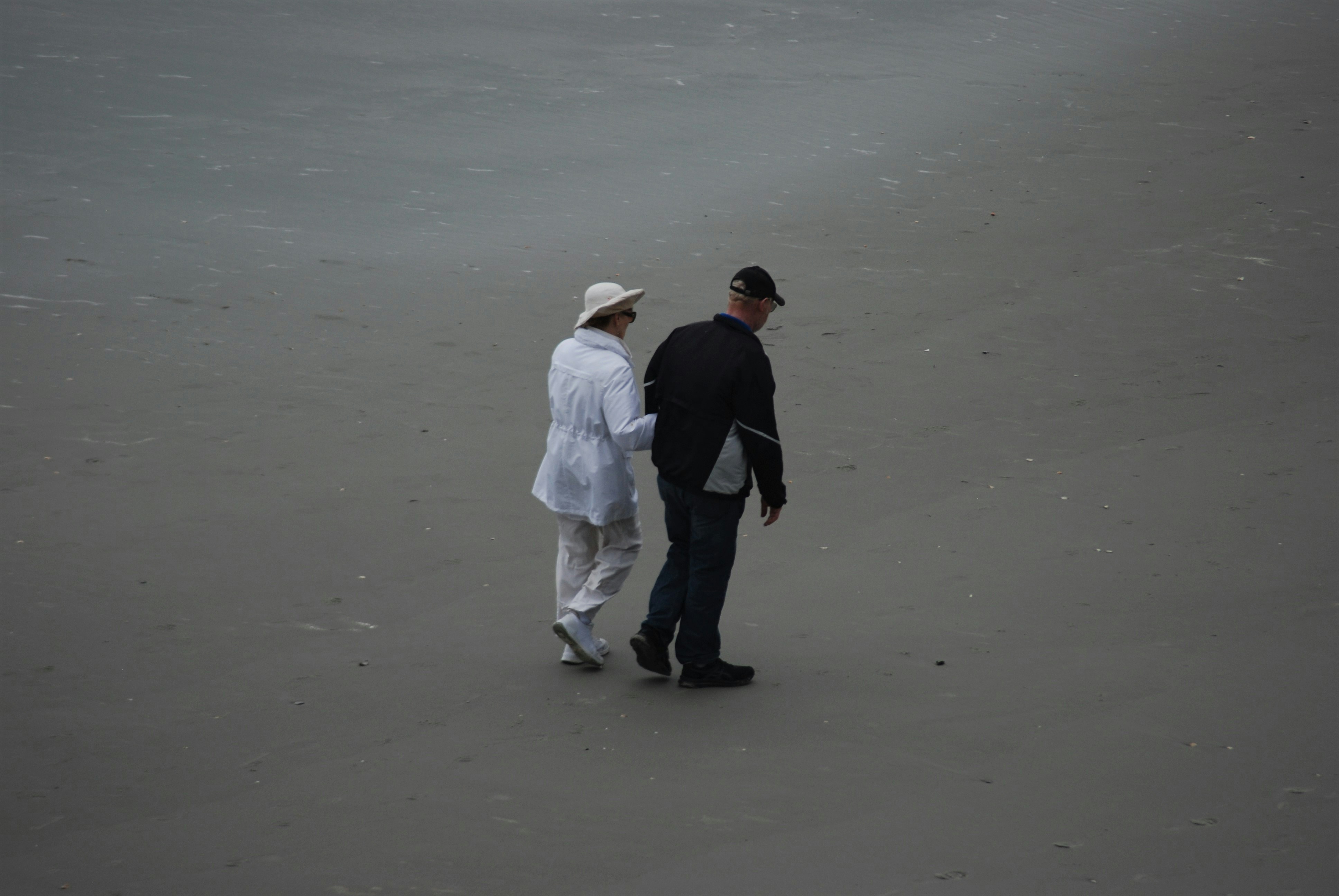 Senior couple walking on beach
