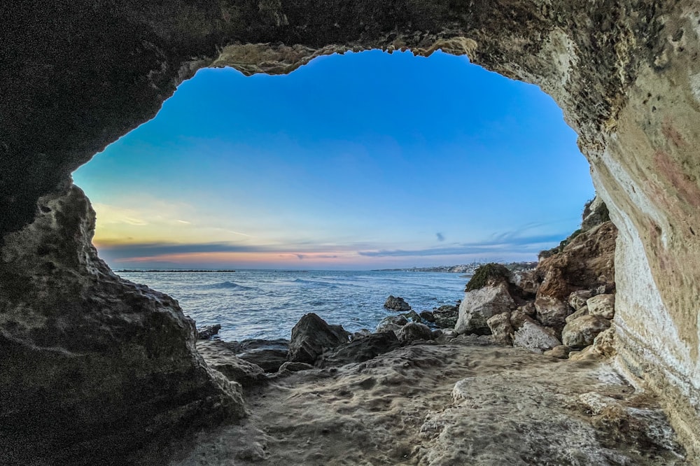 a view of the ocean from inside a cave