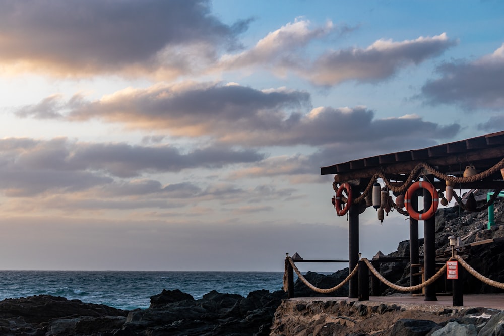 a pier with a rope and a life preserver on it