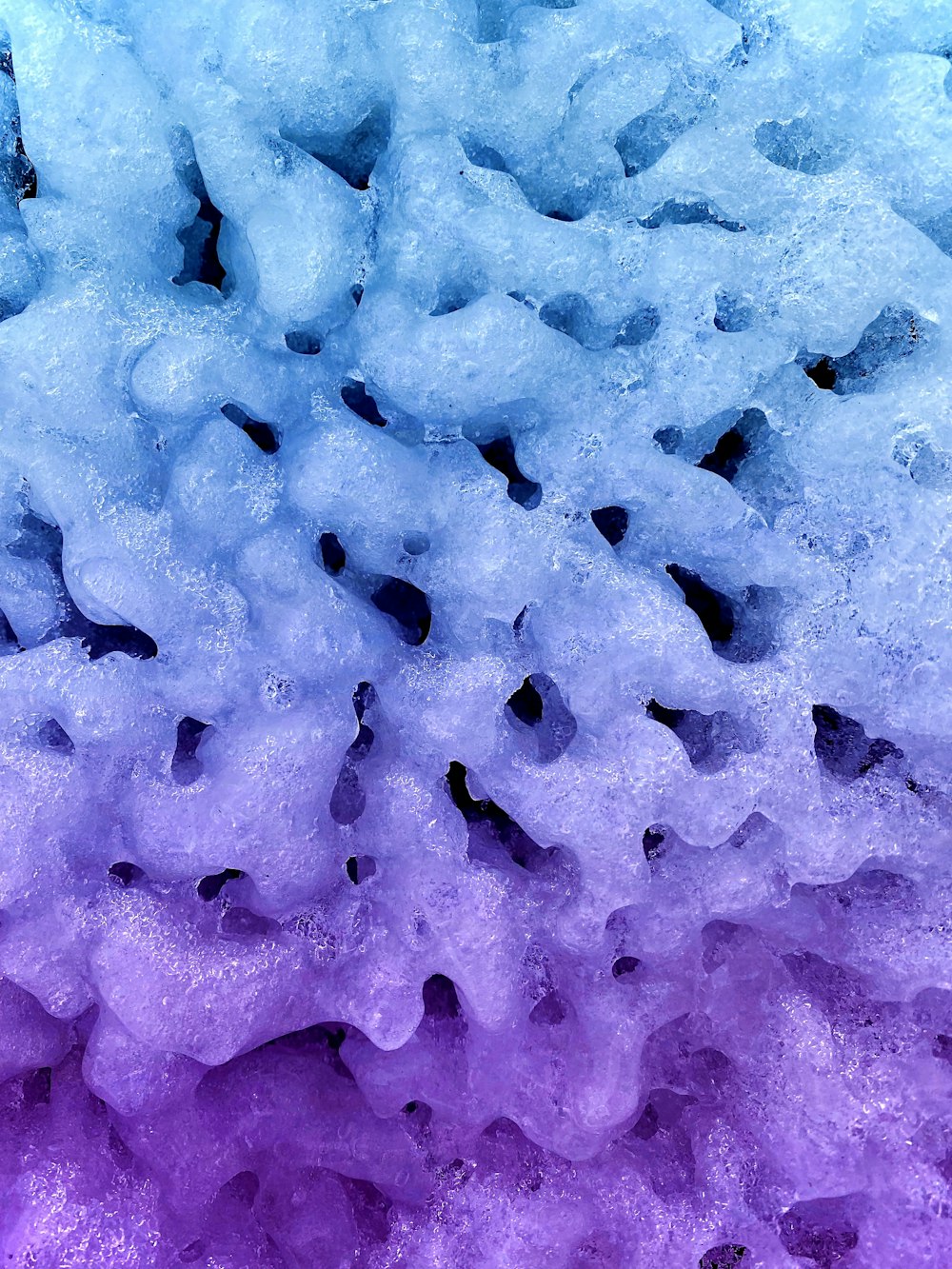 a close up of a purple and blue substance