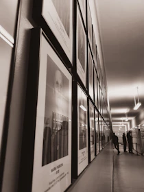 An elegant hallway featuring a series of black and white framed photographs from galleryframe.