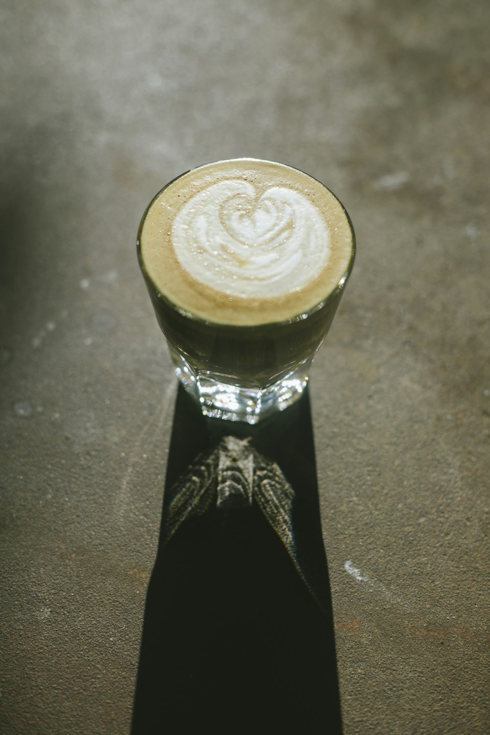 a cappuccino sitting on top of a table