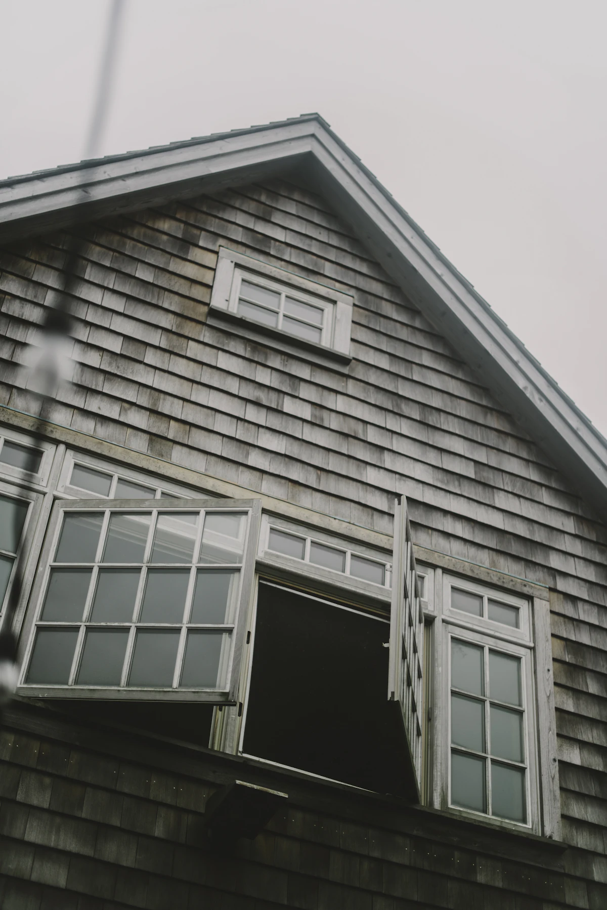 Old house window with shutters