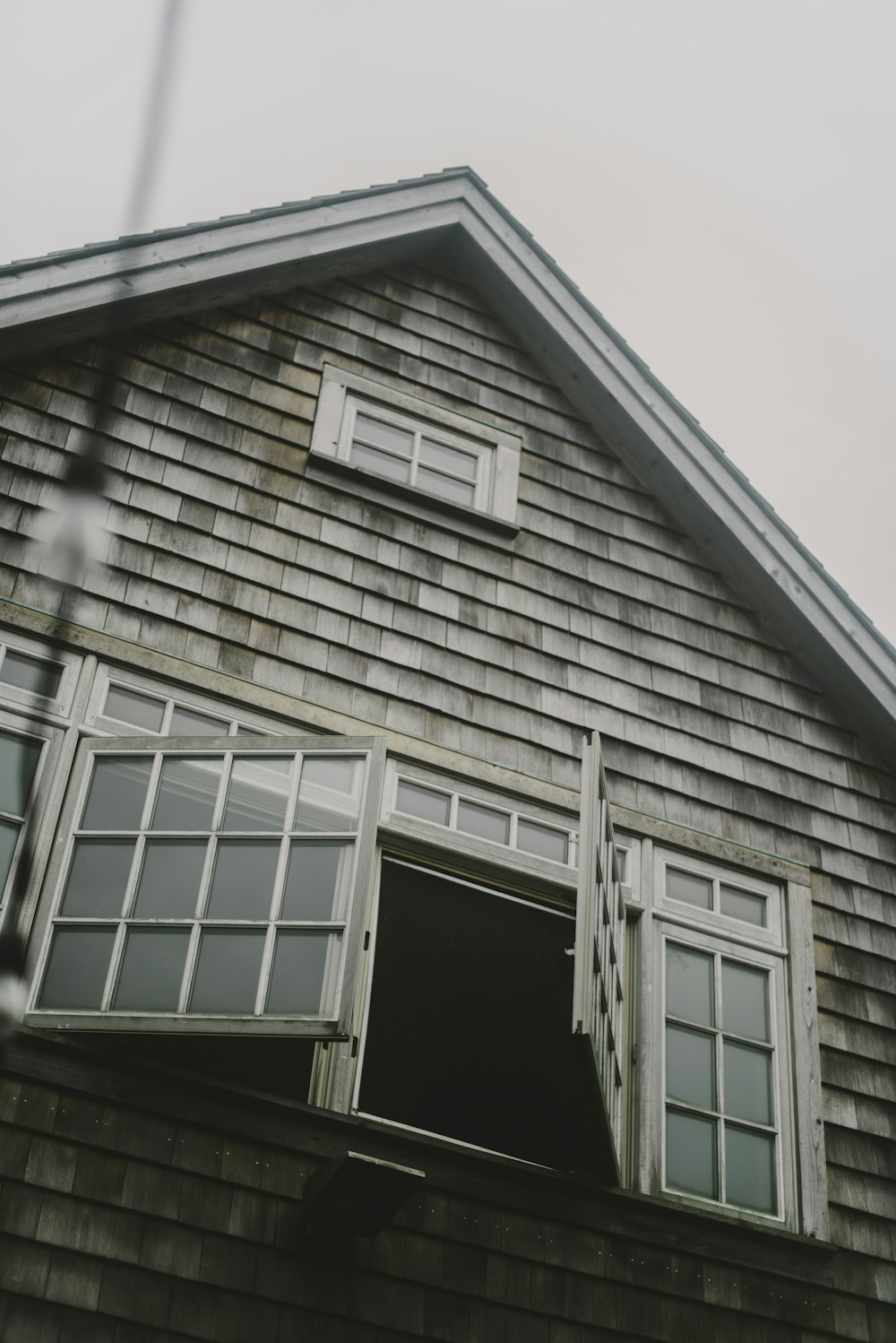 an old house with a window and shutters