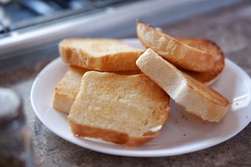 A compact toaster with perfectly toasted bread slices.