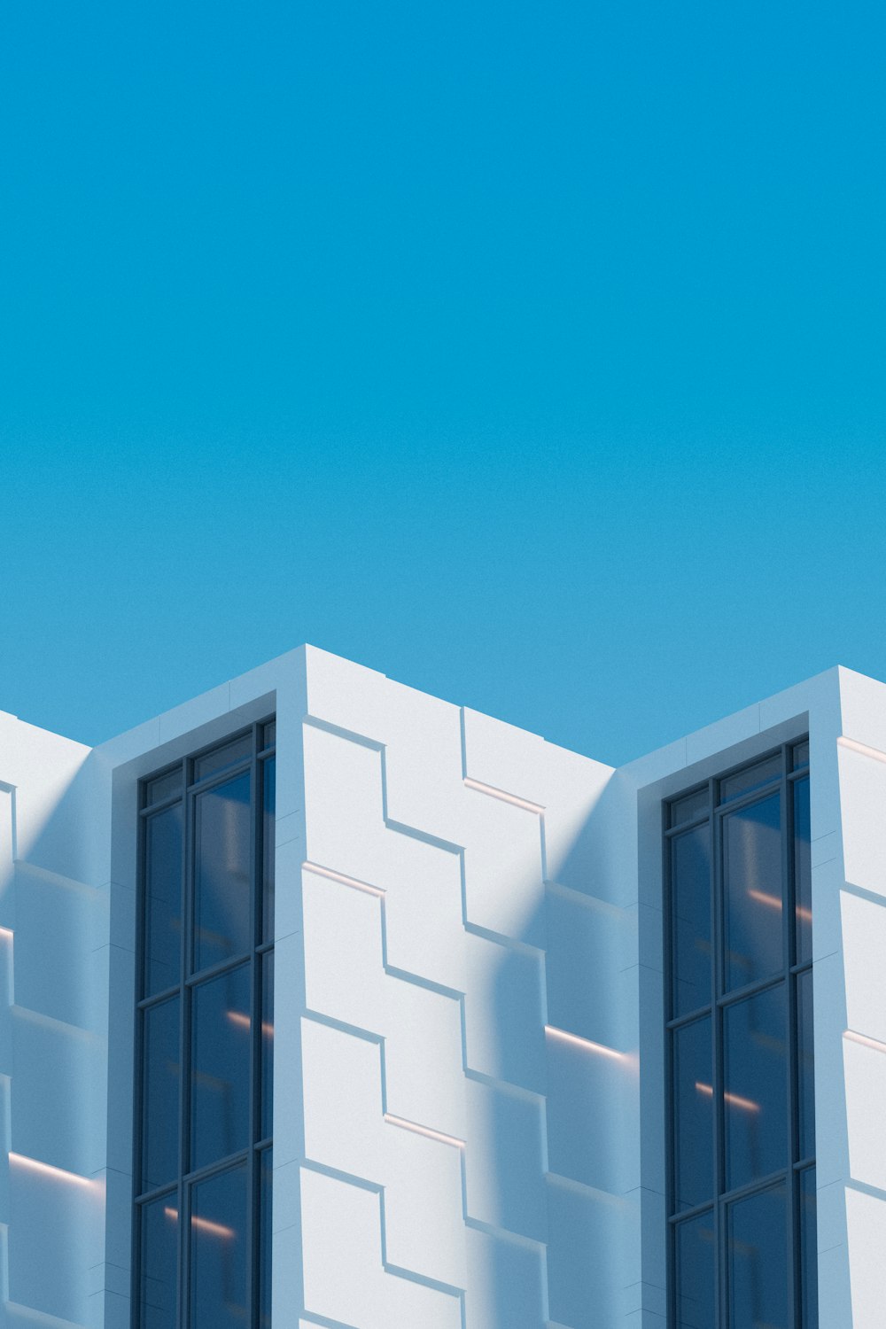 a plane flying over a white building with two windows