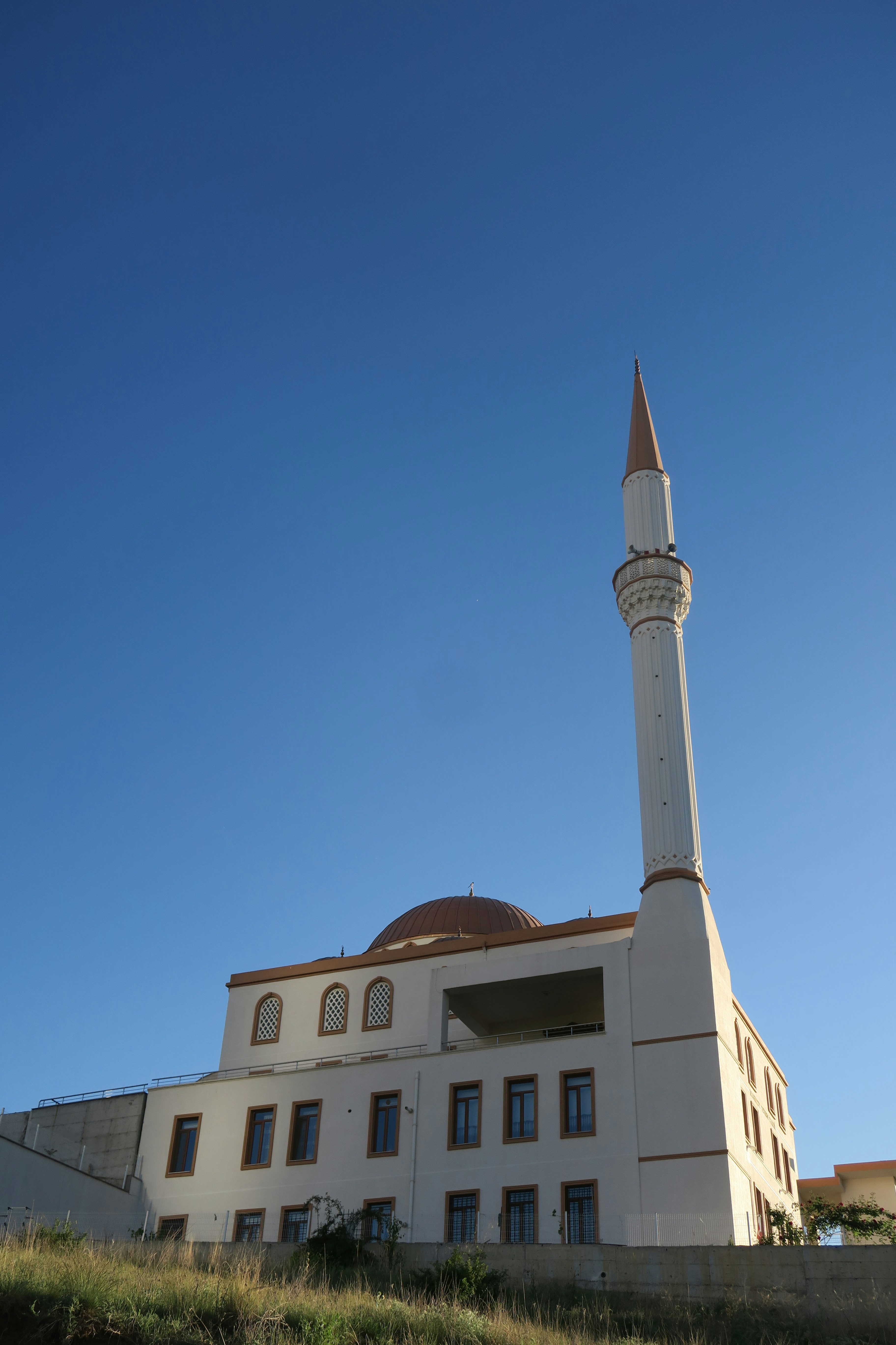 a large white building with a tall tower
