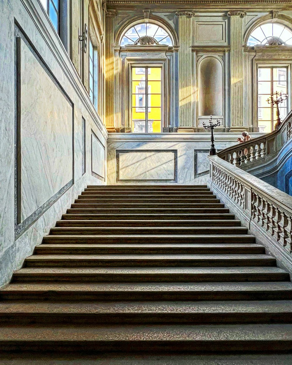a painting of a staircase in a building