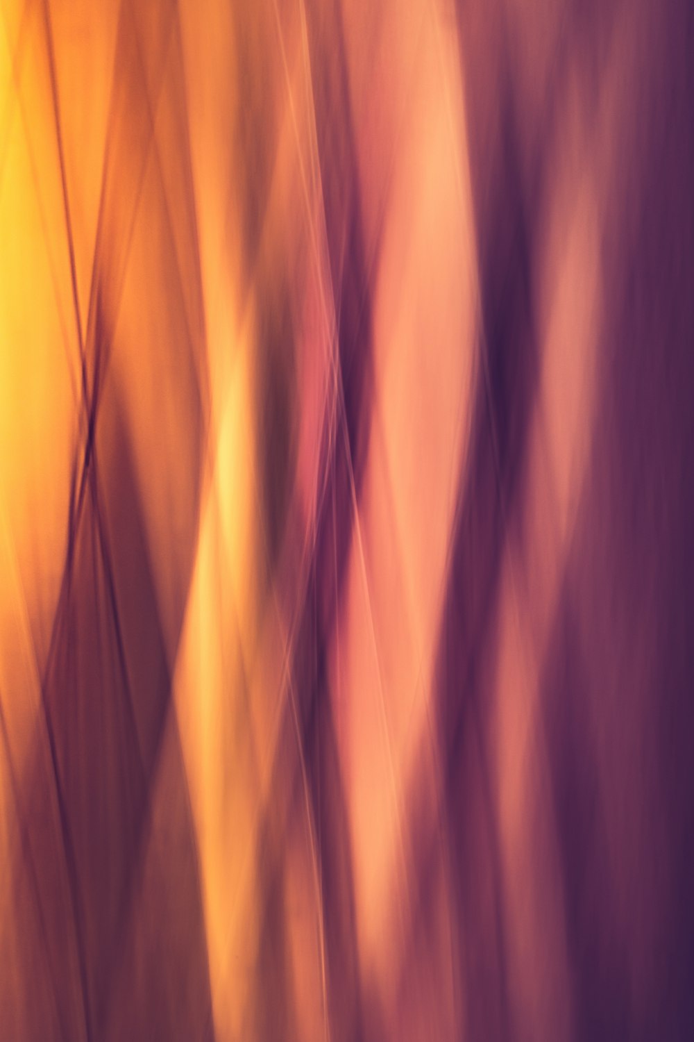 a blurry image of a yellow and purple background