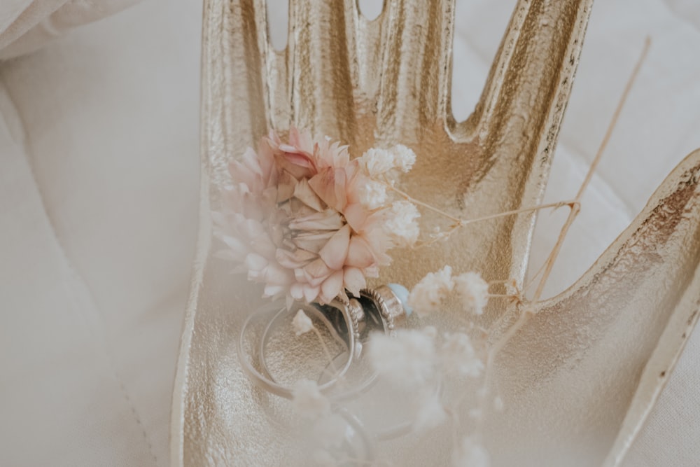 a pair of wedding rings sitting on top of a table