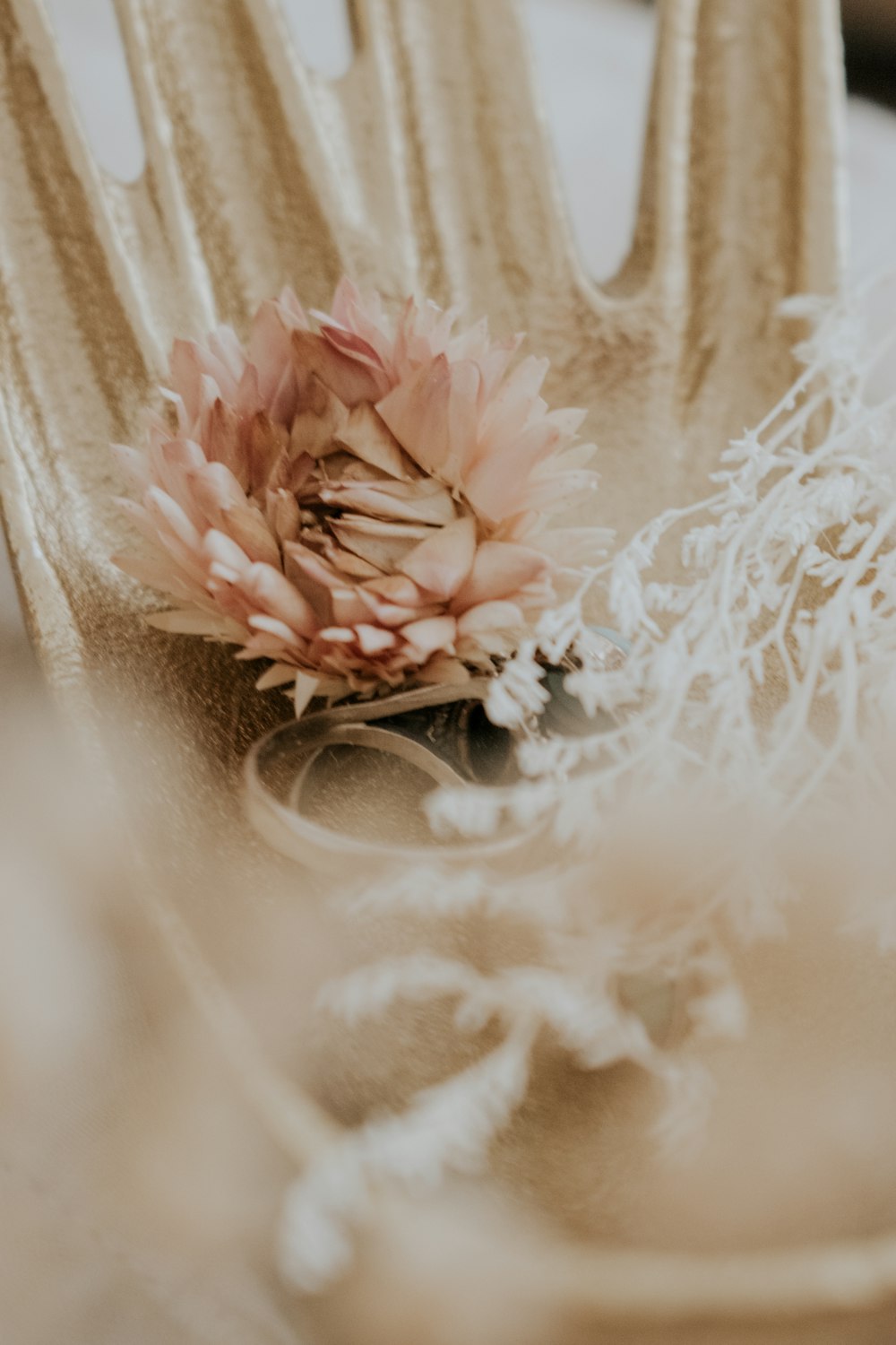 a close up of a fork with a flower on it