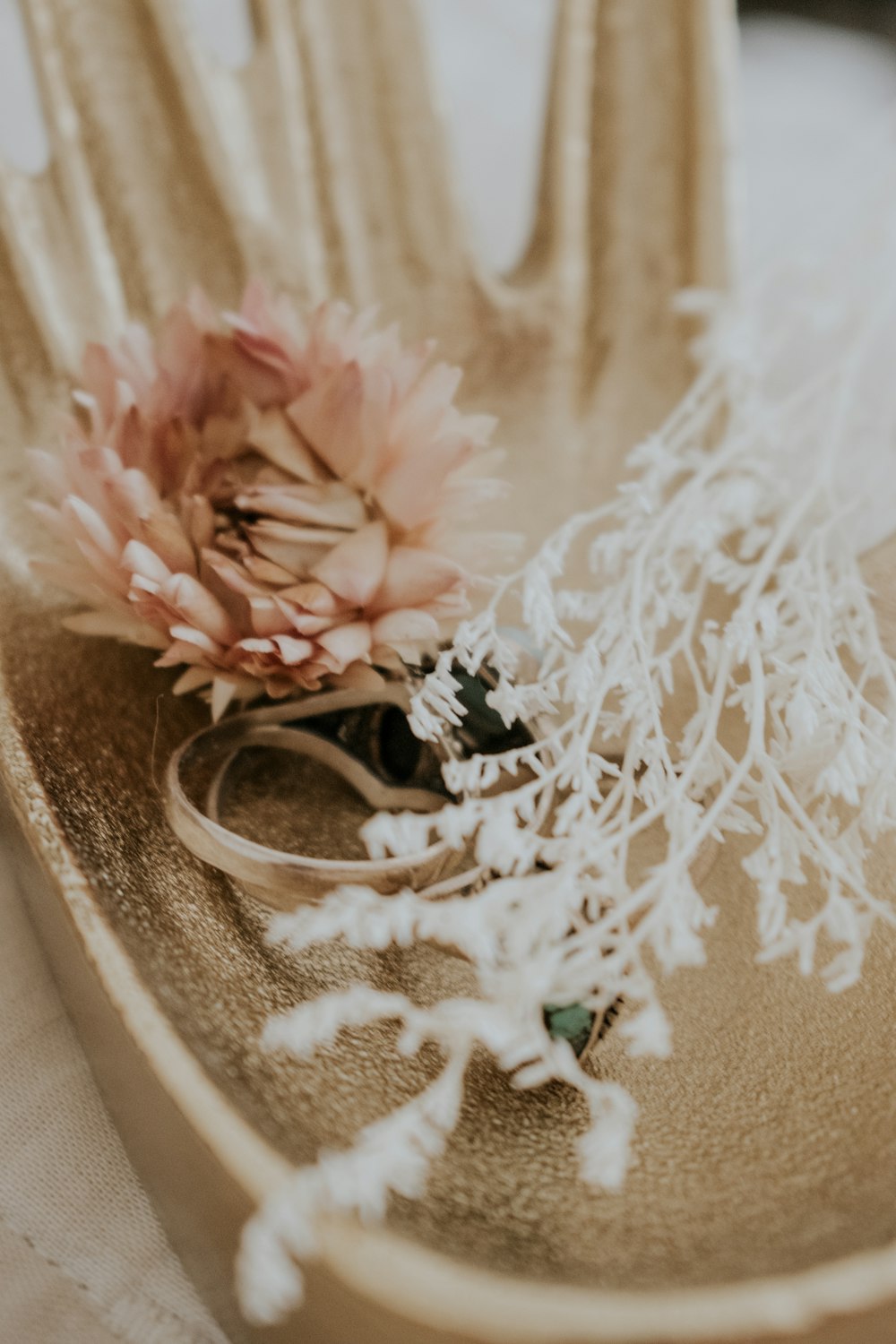 a close up of a flower on a plate