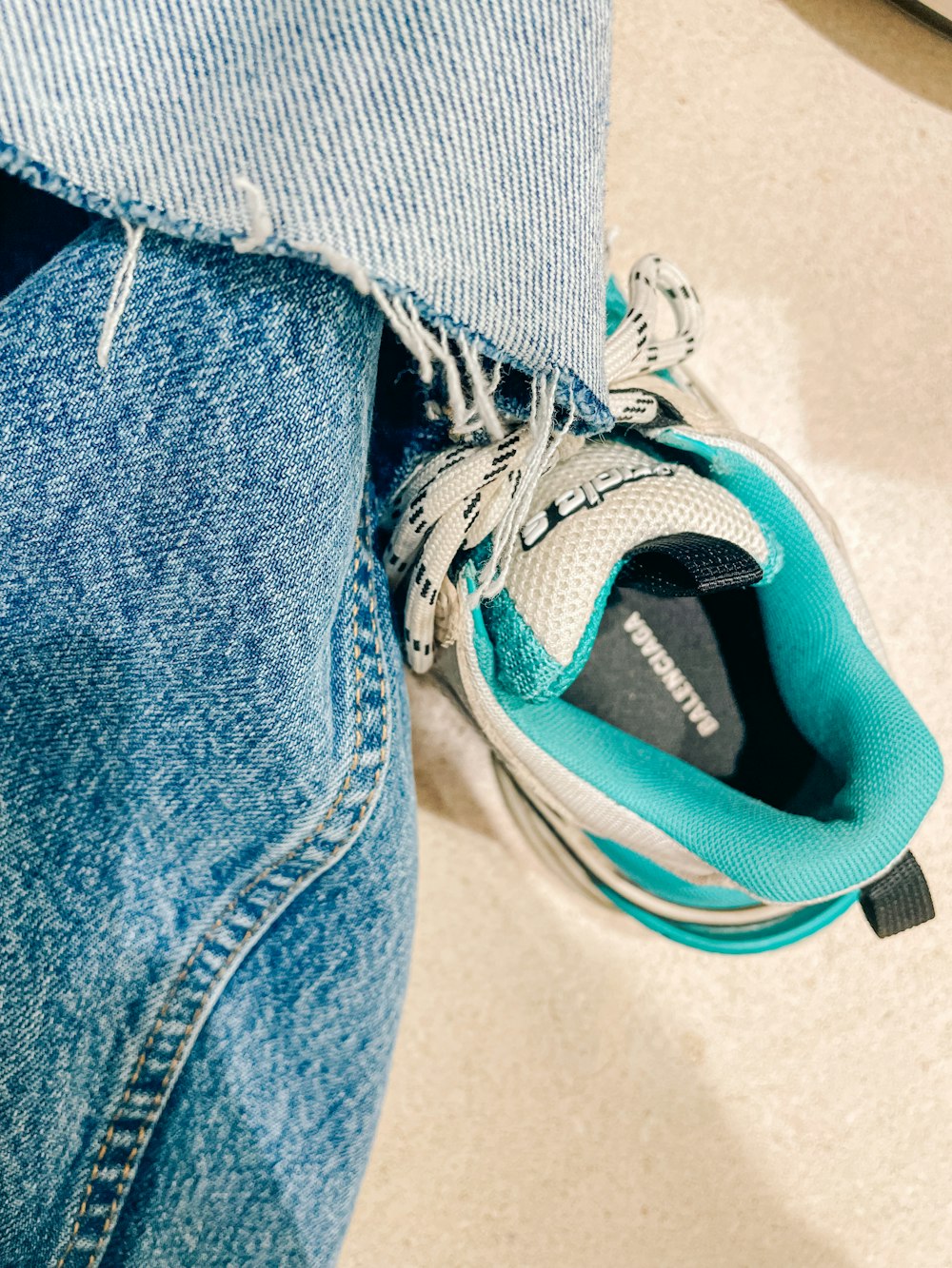 a close up of a person's shoes with a shoelace