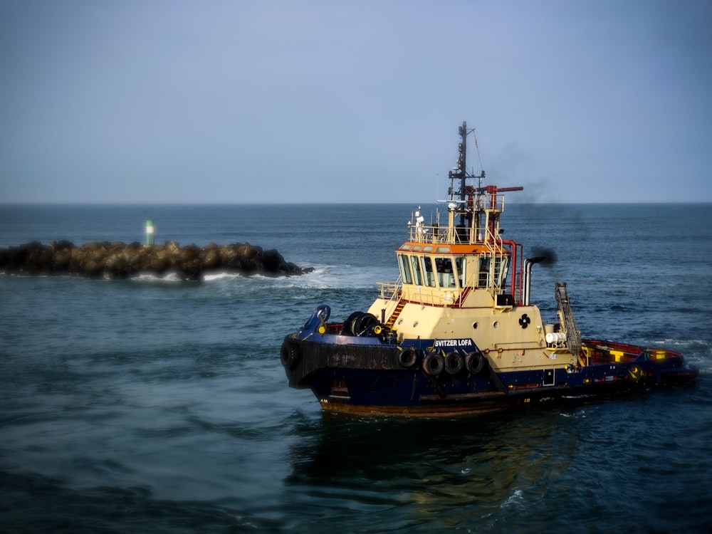 a tug boat in the middle of the ocean