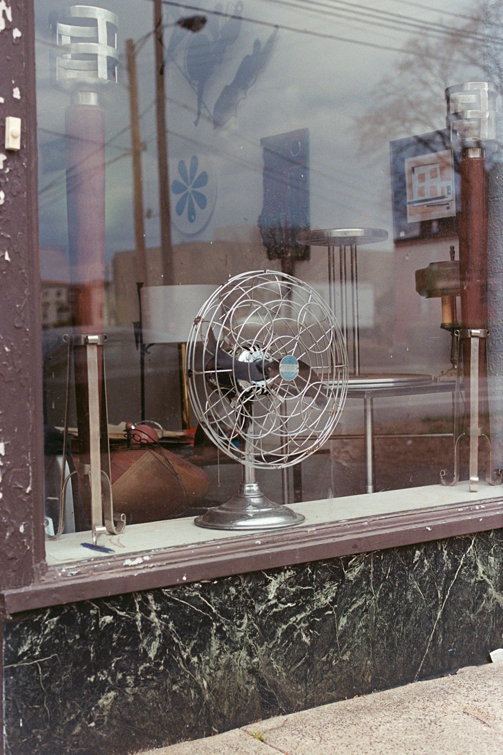 a window that has a fan in it