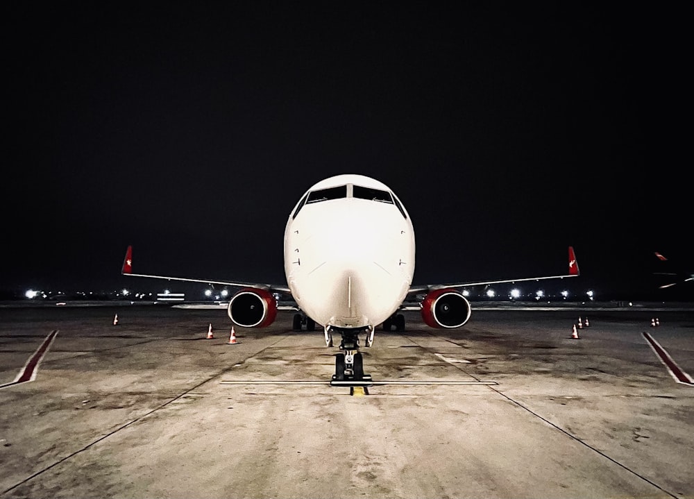 a large jetliner sitting on top of an airport tarmac