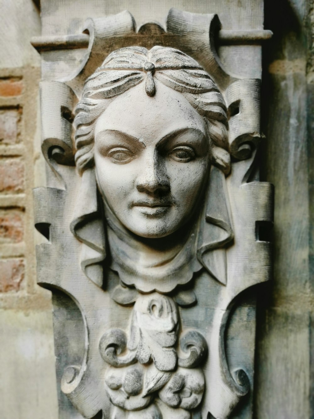 a close up of a statue of a woman