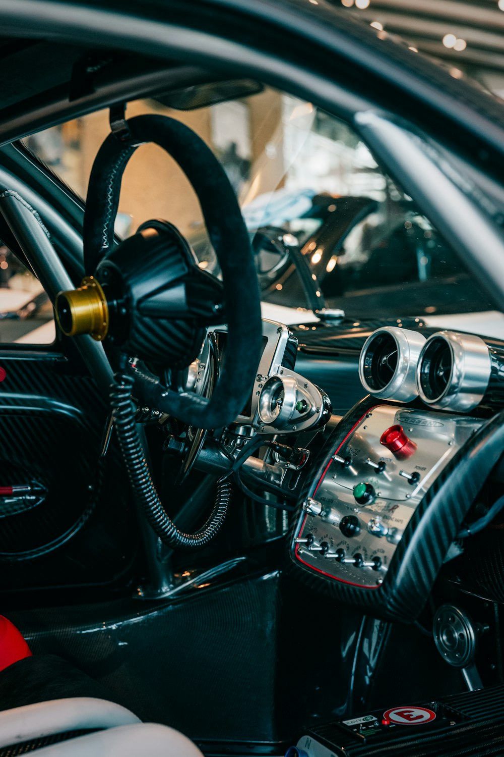 the interior of a car with a steering wheel and dashboard