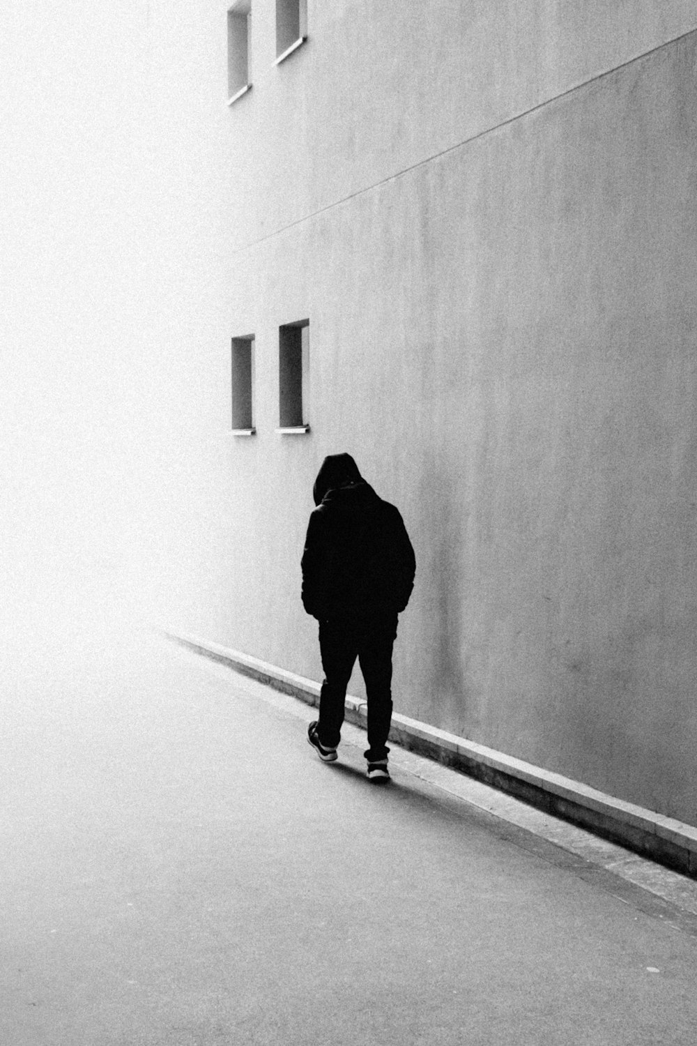 a person standing in front of a wall