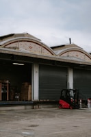 A busy loading dock with crates of specialist rubber materials being prepared.