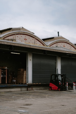 A busy loading dock with crates of specialist rubber materials being prepared.