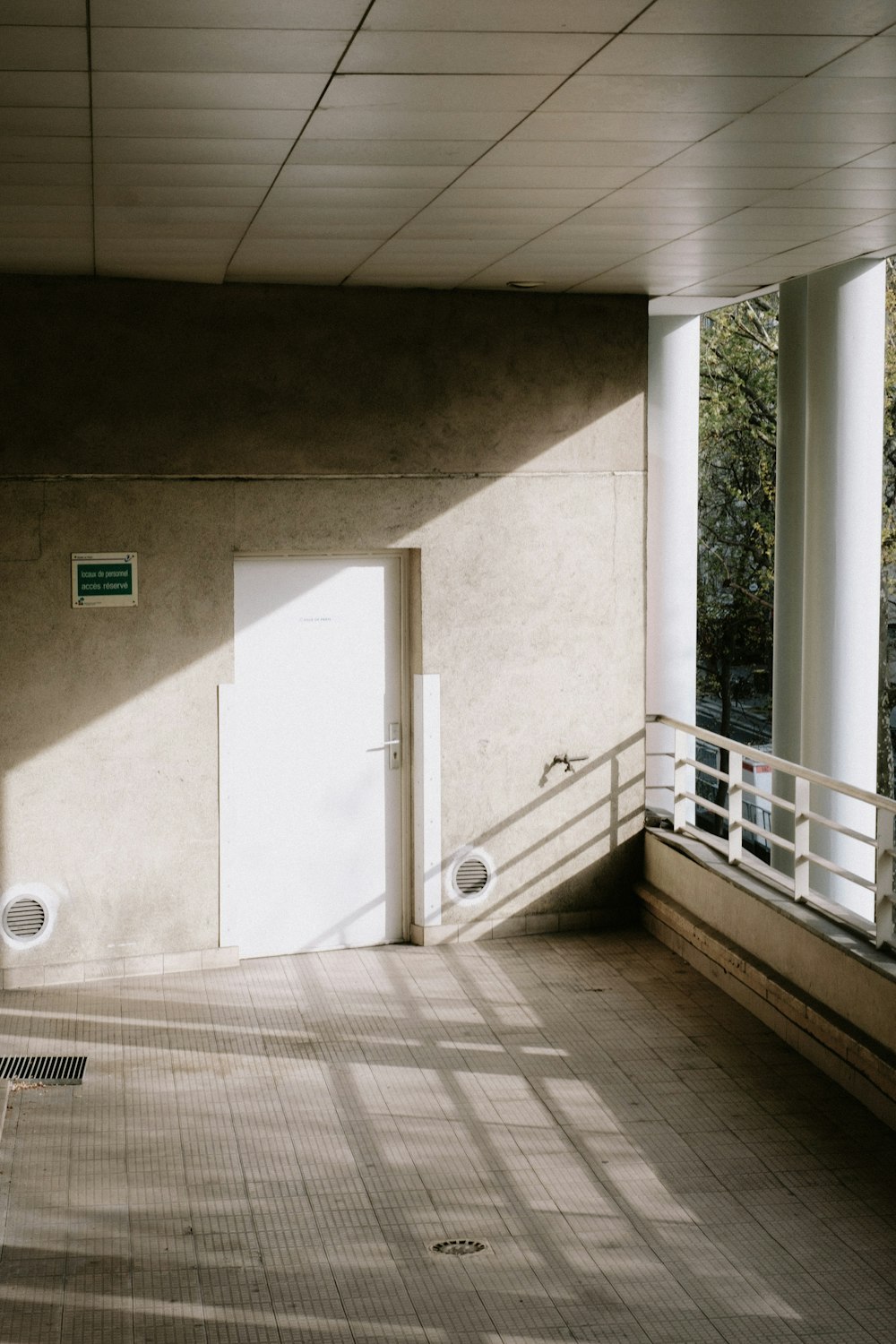 a room with a white door and a white toilet