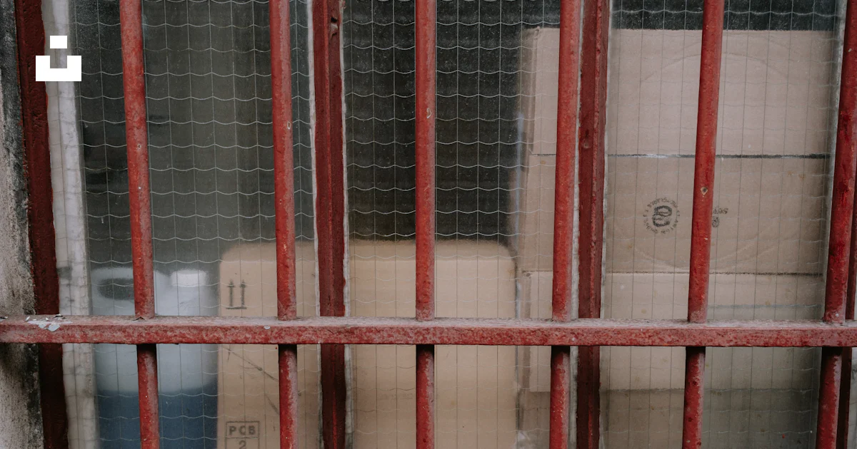 Jaill Box A jail cell with boxes behind bars photo – Free Paris Image on Unsplash