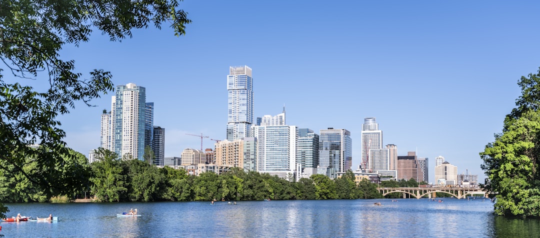 a body of water surrounded by tall buildings,